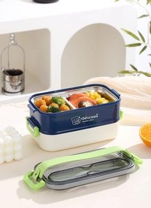 Détail d'une boîte à déjeuner double couche en acier inoxydable avec compartiments