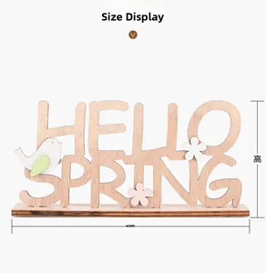Afmetingen van het houten Hello Spring tafelornament met vogel- en bloemfiguren