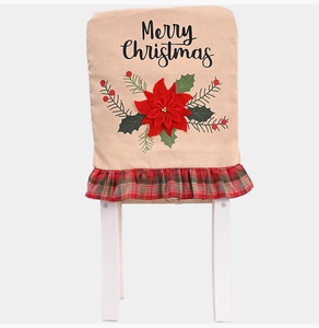 Detail of Christmas chair cover with red poinsettia floral applique and plaid ruffle