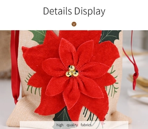 Detailed macro view of linen wine bottle bag with red poinsettia flower and satin drawstring