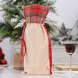 Christmas burlap wine bottle gift bag with red poinsettia and plaid drawstring detail