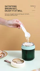 Detail of portable green stainless steel soup cup showing internal folding spoon and handle