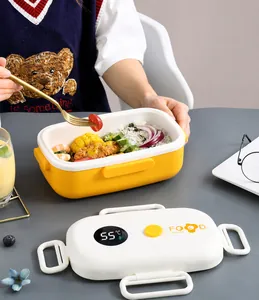 Detail view of the yellow lunch box lid showing the digital temperature display and valve