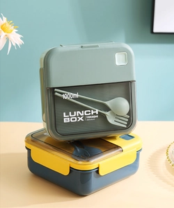 Stackable 1000ml double-layer bento lunch boxes with built-in cutlery storage and lids