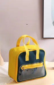 Detail of insulated lunch bag with contrast yellow and navy panels and front PVC pocket