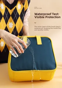 Waterproof test on oxford fabric lunch bag showing dry interior and yellow handle