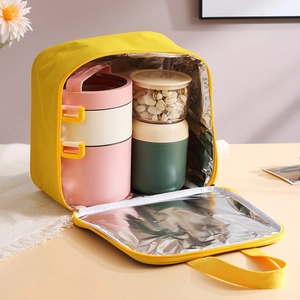 Insulated yellow canvas lunch bag with aluminum foil lining and portable handle
