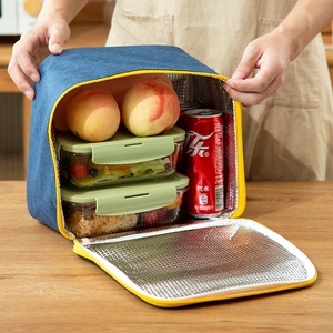 Insulated navy denim lunch bag with thick aluminum foil lining and yellow zipper closure