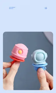 Detail view of pink and blue astronaut popsicles with round non-slip handles for kids