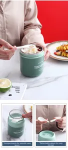 Detail of insulated soup cup with hidden spoon compartment and detachable white spoon