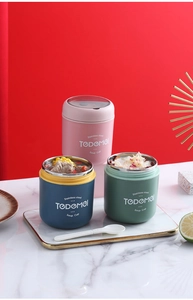 Close-up of stainless steel insulated soup cups with lids and plastic spoons in a set