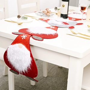 Macro view of Christmas gnome placemats and table runners with festive snowflake patterns