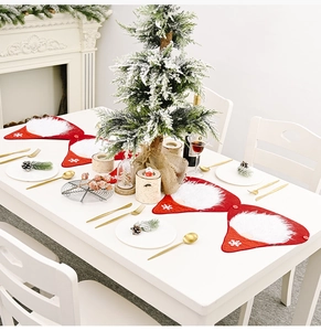 Set of four red Santa Claus placemats with white faux fur beard for holiday table decor