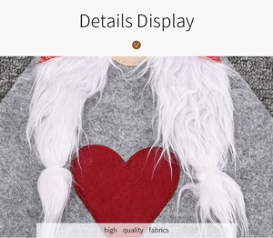 Detail of Christmas table runner featuring red heart applique and white faux fur braids