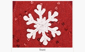 Close-up of a white felt snowflake on red knit fabric with sparkling red sequins