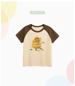 Detail of raglan short sleeve T-shirt for kids with cute camping bear and size tag