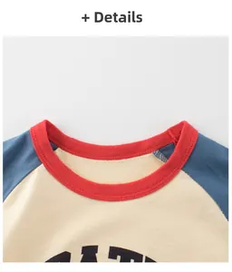 Detail of red ribbed crew neck and raglan sleeves on a cotton cartoon t-shirt