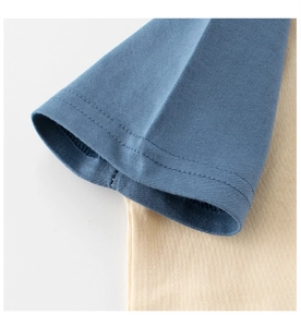 Detail of navy blue contrast sleeve on cotton t-shirt with durable double-needle stitching