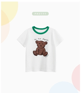 Detail of soft cotton kids t-shirt with hand-drawn bear and contrast green collar