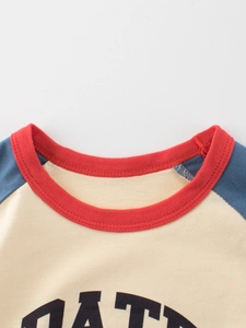 Kids' raglan sleeve cotton t-shirt featuring color-block design and crew neck style