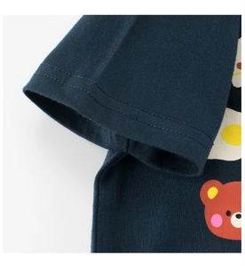 Detail of double-needle stitching on navy blue cotton T-shirt sleeve with bear print