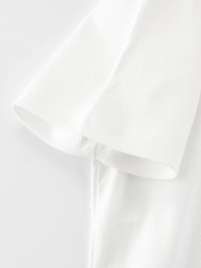Close-up of sleeve stitching on a white cotton T-shirt for kids showing double-needle hem