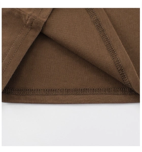 Detail view of double-needle stitching and high-quality knit cotton fabric in dark brown