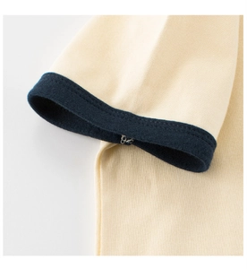 Detailed macro view of the contrast rib knit cuffs on a cotton children's summer T-shirt