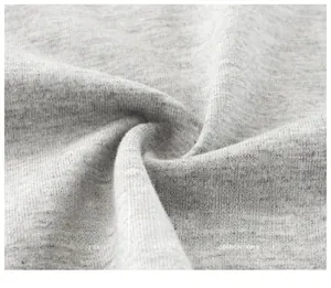 Close-up of soft grey cotton knit fabric showing breathable texture and fine fibers