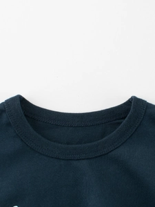 Detail of dark blue cotton kids T-shirt with reinforced double-needle ribbed neckline