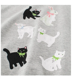 Close-up of grey cotton fabric with cute hand-drawn cat and rabbit patterns for kids