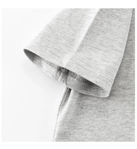 Close-up of double-stitched sleeve cuff on grey cotton kids' T-shirt with fine texture