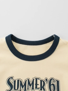 Detail of beige cotton T-shirt with navy contrast crew neck and SUMMER '61 print