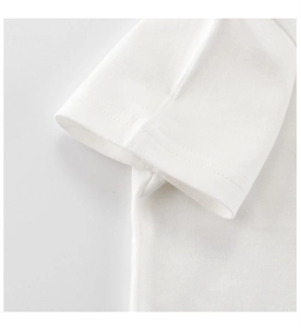 Close-up of sleeve stitching and cotton fabric detail on a white toddler T-shirt