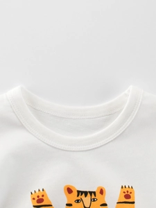 White cotton t-shirt for kids featuring a cute cartoon tiger print and a ribbed crew neck