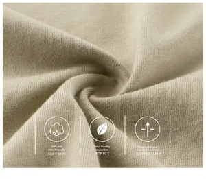 Close-up of beige cotton knit fabric showing soft texture and A-level safety quality