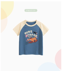 Detail view of children's raglan short-sleeve tee with cartoon dog skateboard print