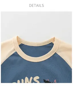Detail of child's contrast raglan sleeve T-shirt with ribbed crew neck and fine stitching
