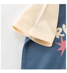 Detail of raglan sleeves and vintage star print on navy blue cotton kids t-shirt
