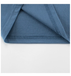 Close-up of double-stitched hem on a blue cotton knit T-shirt for kids clothing