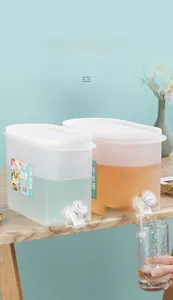 Detailed view of 3.5L plastic cold water dispenser with faucet on table edge