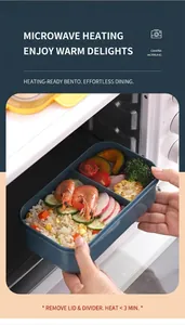 Deep blue lunch box with two compartments shown being placed in a microwave oven
