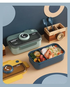 Detail view of 1100ml camera-style lunch box with dual compartments and utensils