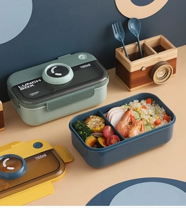 Detail of 1100ml divided lunch box showing compartments with rice and vegetables
