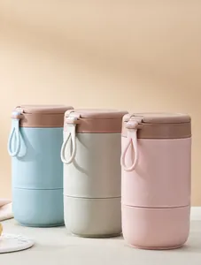 Three assorted Morandi-colored portable double-layer breakfast cups with silicone handles