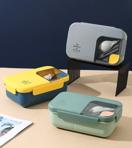 Detailed view of stackable bento boxes with cutlery compartment and stylish color options