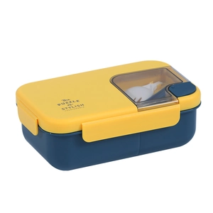 Japanese style yellow and blue bento lunch box with compartments and utensils