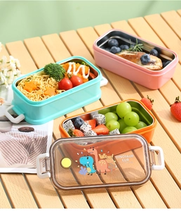 Detail der Kinder-Lunchbox aus 304 Edelstahl mit buntem Design und lustigem Dino-Motivdeckel