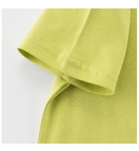 Detailed close-up of lime green cotton t-shirt sleeve with clean double-needle stitching