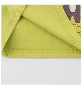 Close-up of the double-needle stitching on the hem of a green cotton baby t-shirt